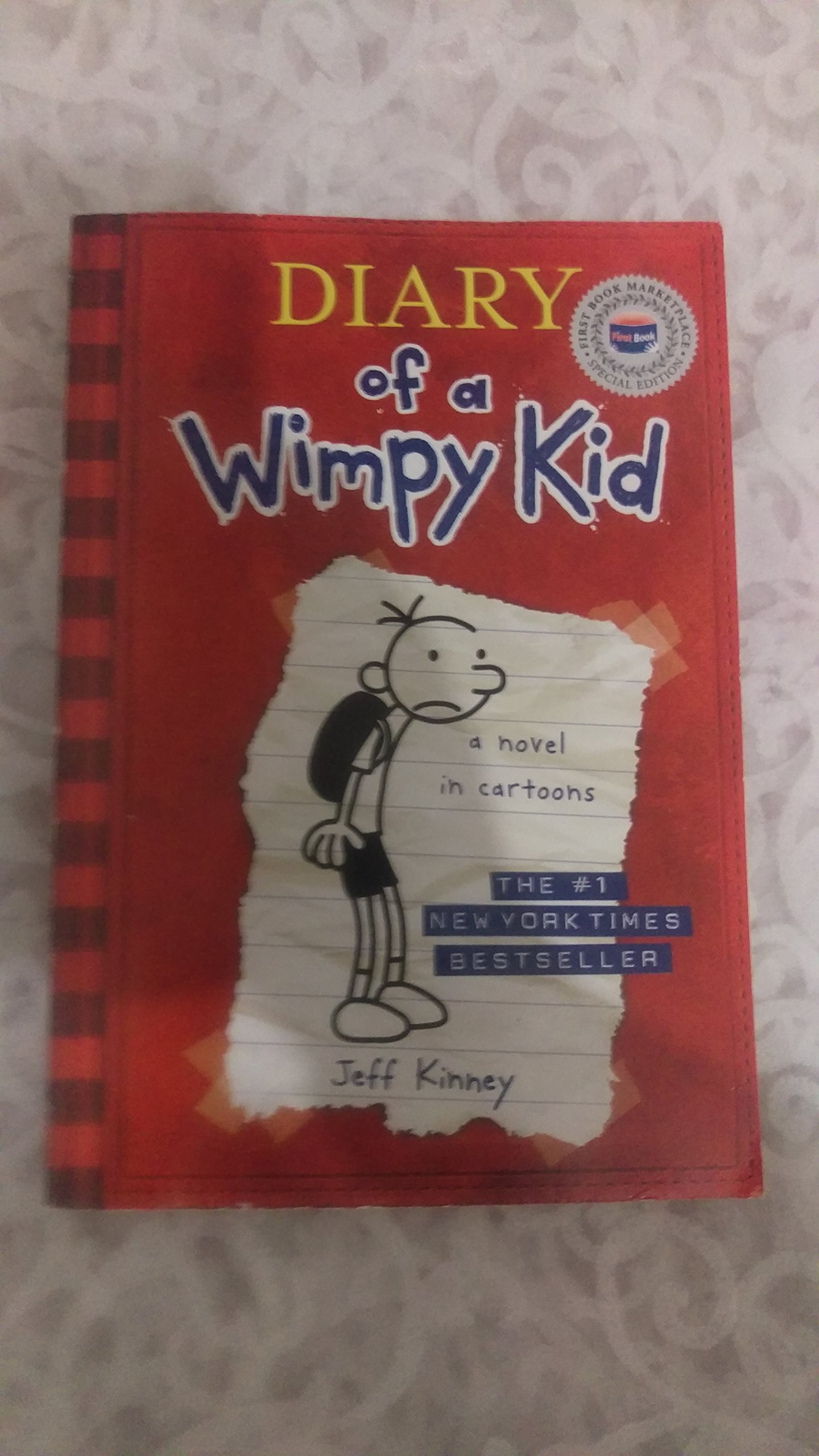 Diary of a Wimpy Kid, a Novel in Cartoons